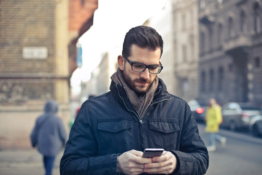 blur-buildings-cars-775091 myQ man on phone